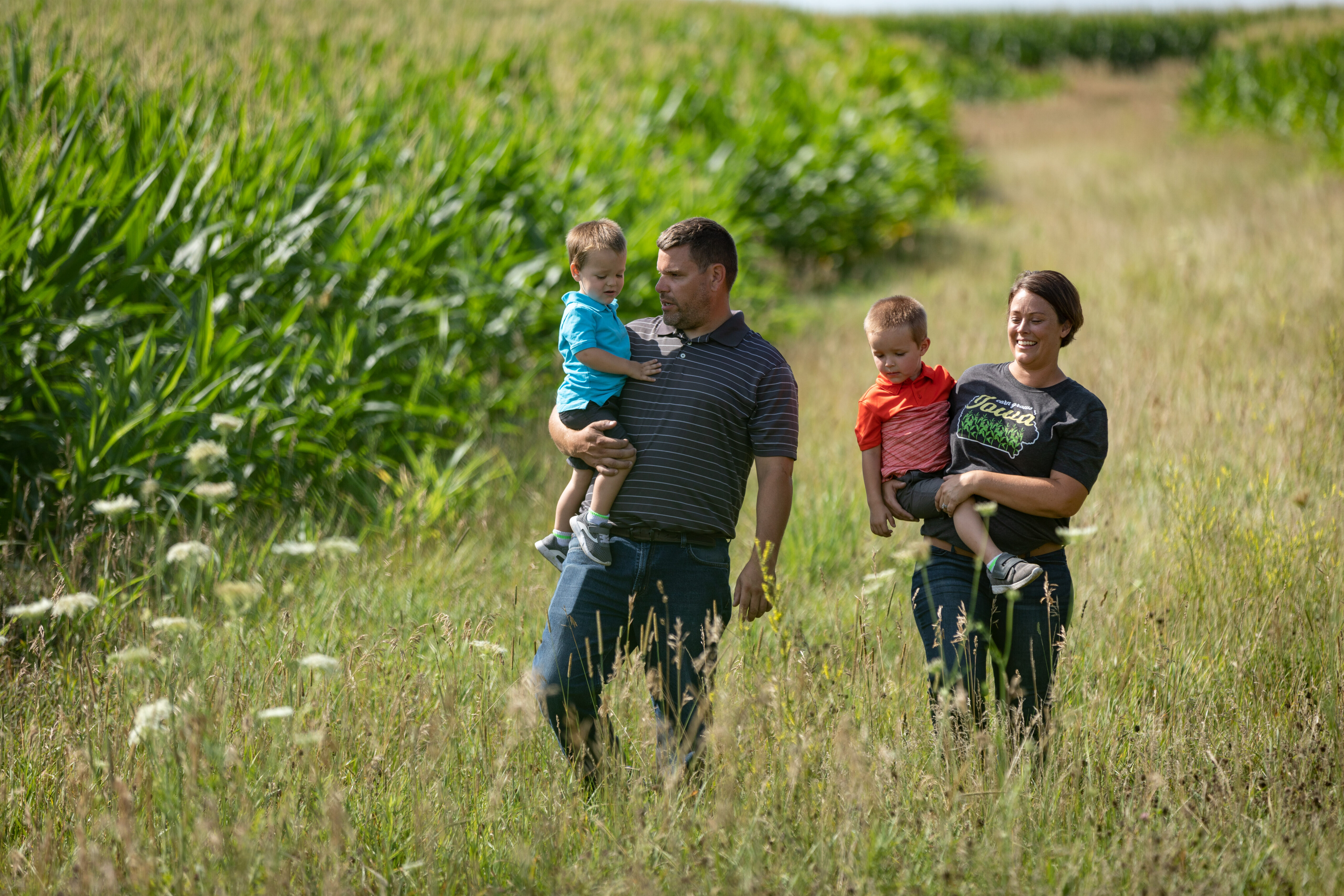 Iowa farm family walking through field