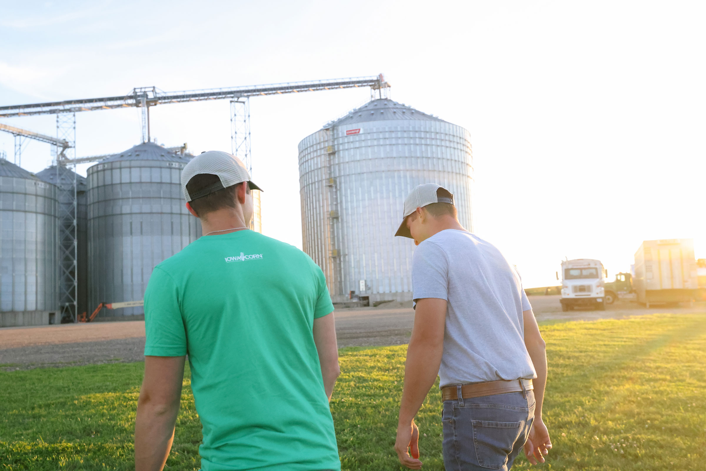 two farmers walking in field in Iowa