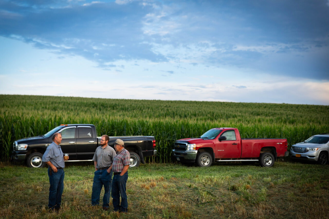 Iowa corn farmers in field